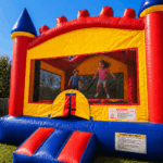 kids jumping in colorful bounce house