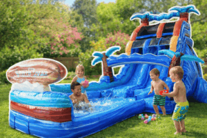 Kids playing on a backyard water slide bounce house in a sunny spring setting